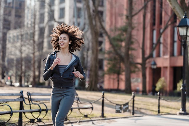 a woman is running with music