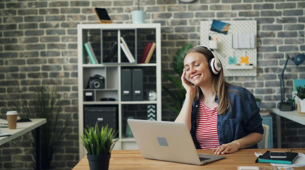 A girl using headphones for studying